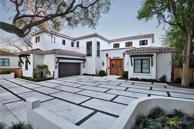 a front view of a house with yard