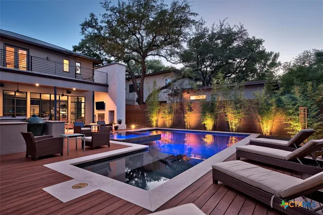 a living room with patio furniture and a fireplace