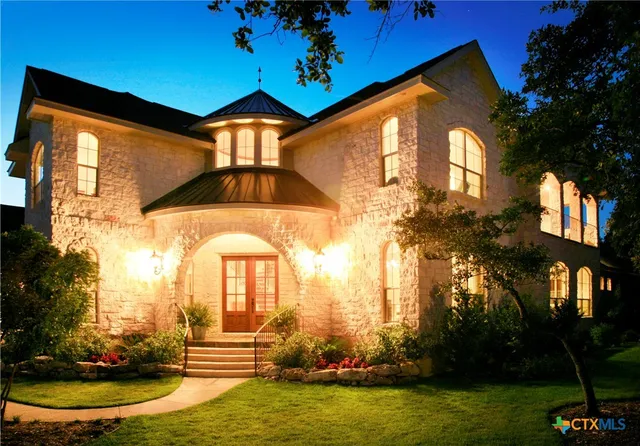 a living room with furniture pool table and a fireplace