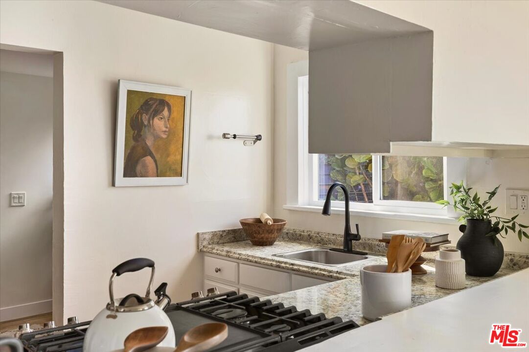 621 Isabel Street Los Angeles, CA 90065 - Photo 11 of 38 a kitchen with a sink and a stove top oven