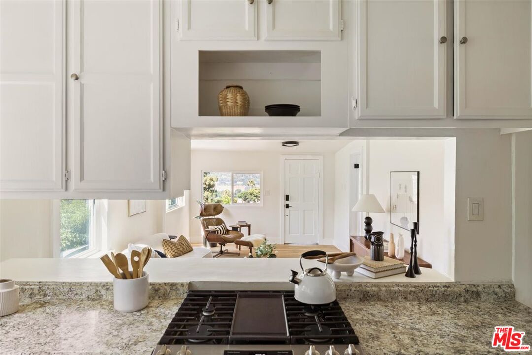 621 Isabel Street Los Angeles, CA 90065 - Photo 12 of 38 a table chair in a kitchen next to a window