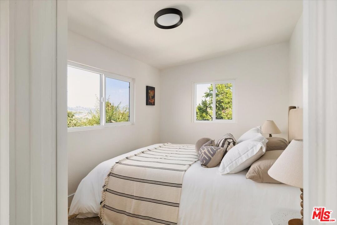 621 Isabel Street Los Angeles, CA 90065 - Photo 15 of 38 a bedroom with a bed and a window