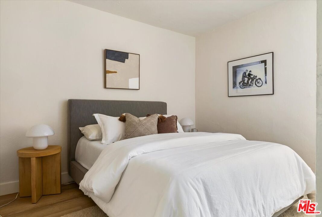 621 Isabel Street Los Angeles, CA 90065 - Photo 16 of 38 a bedroom with a bed and a lamp