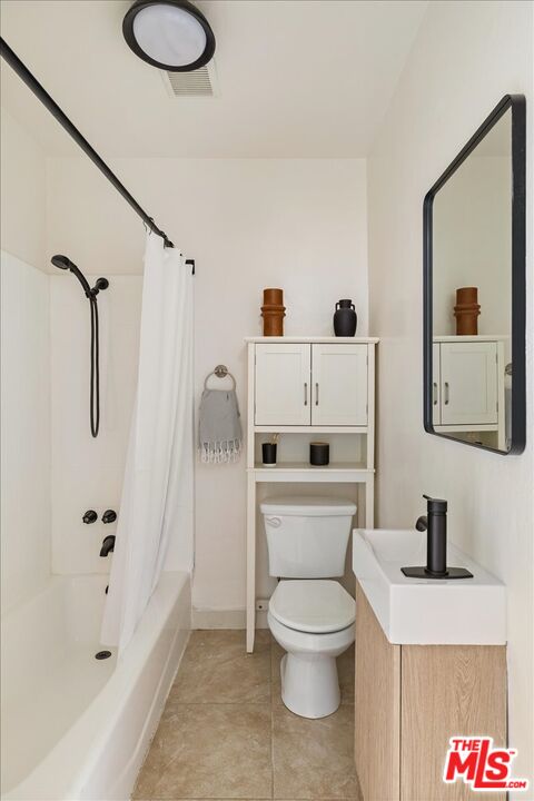 621 Isabel Street Los Angeles, CA 90065 - Photo 18 of 38 a white toilet sitting next to a bathroom sink