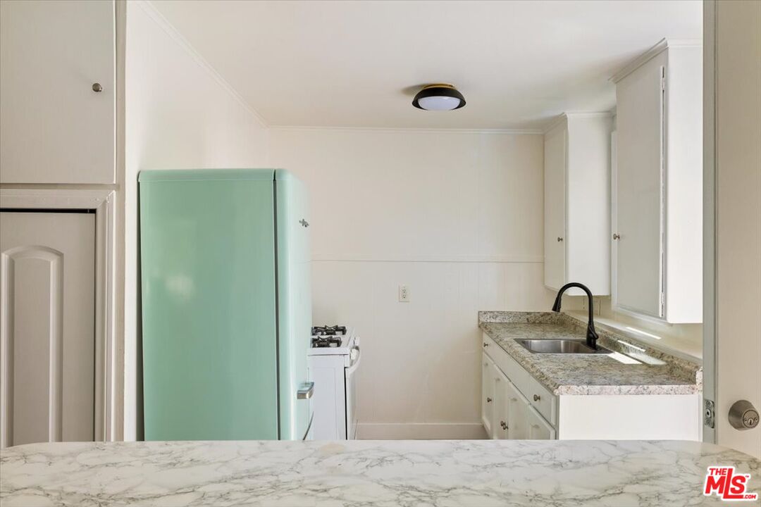 621 Isabel Street Los Angeles, CA 90065 - Photo 22 of 38 a bathroom with a sink and a mirror