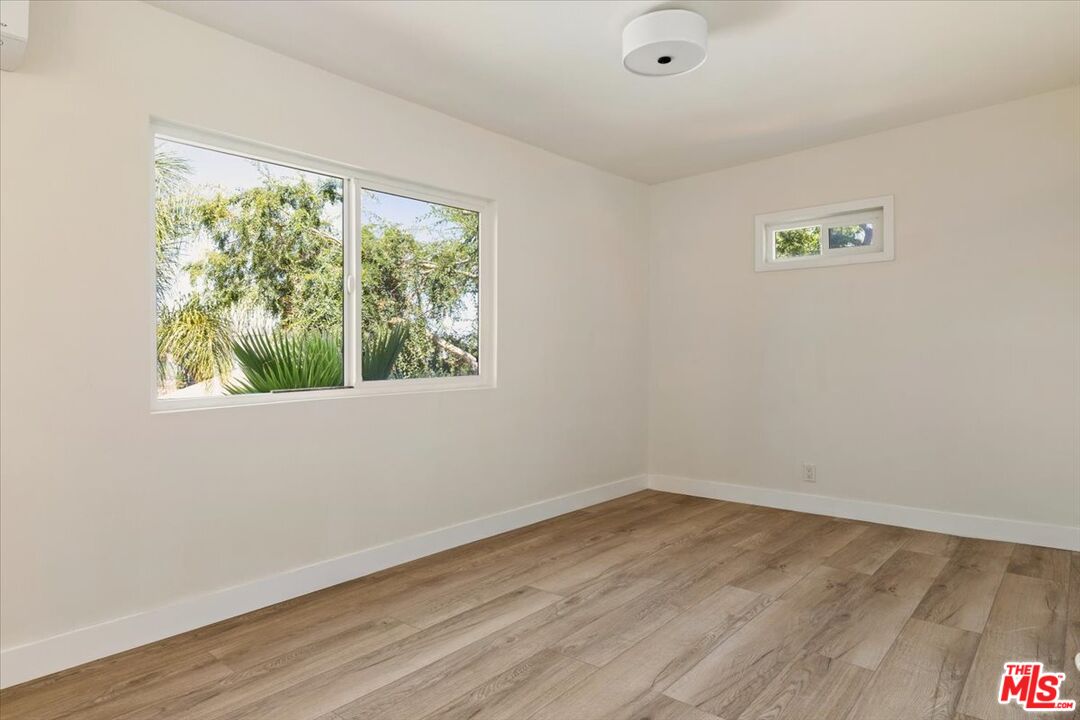 621 Isabel Street Los Angeles, CA 90065 - Photo 24 of 38 wooden floor in an empty room with a window