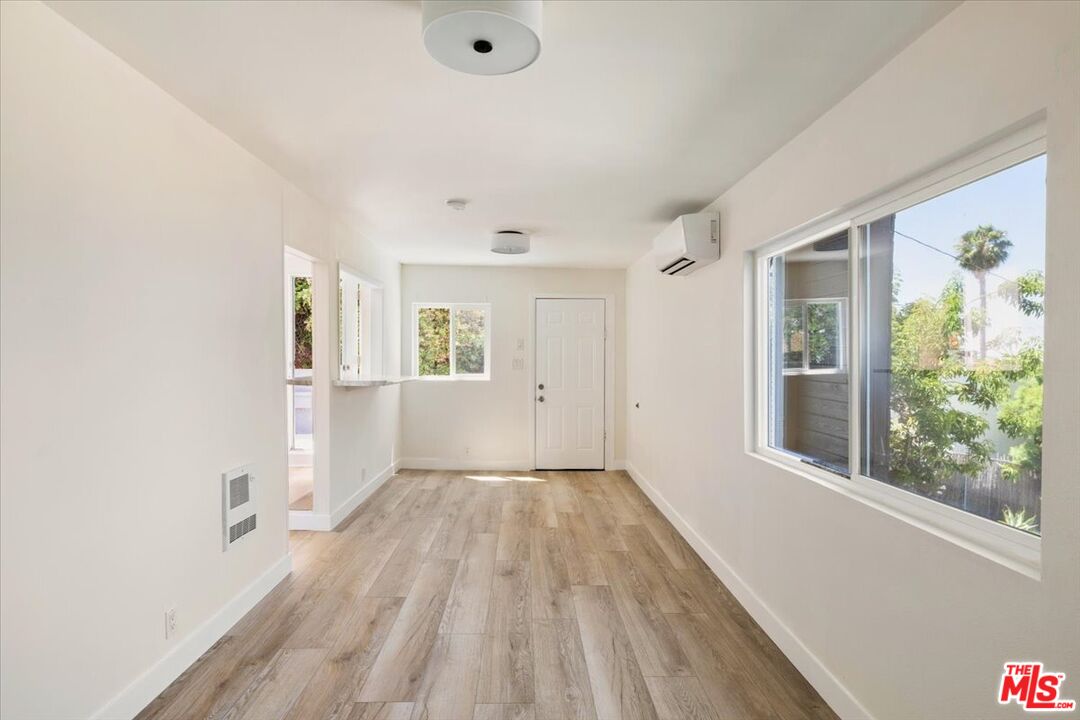 621 Isabel Street Los Angeles, CA 90065 - Photo 25 of 38 wooden floor in an empty room with a window