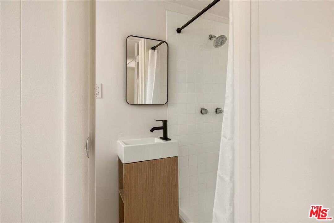 621 Isabel Street Los Angeles, CA 90065 - Photo 27 of 38 a bathroom with a sink and mirror