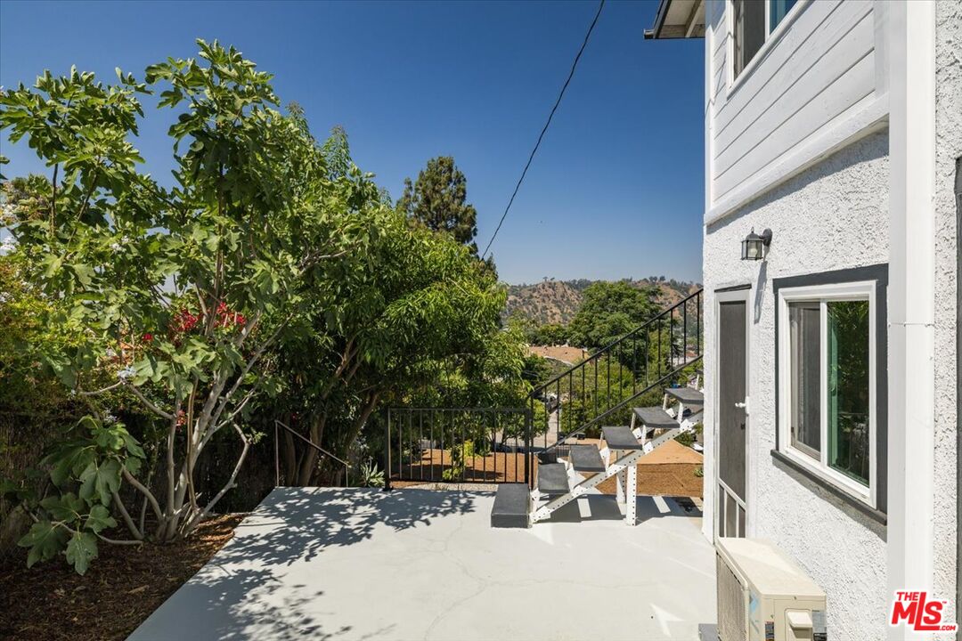 621 Isabel Street Los Angeles, CA 90065 - Photo 3 of 38 a view of a patio with table and chairs and potted plants