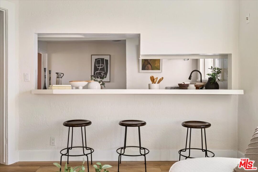 621 Isabel Street Los Angeles, CA 90065 - Photo 9 of 38 a kitchen with stainless steel appliances a table and chairs