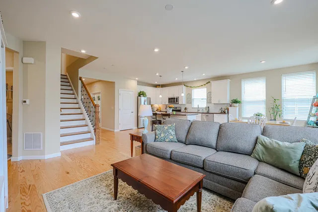 a view of a dining room with furniture and a book shelf