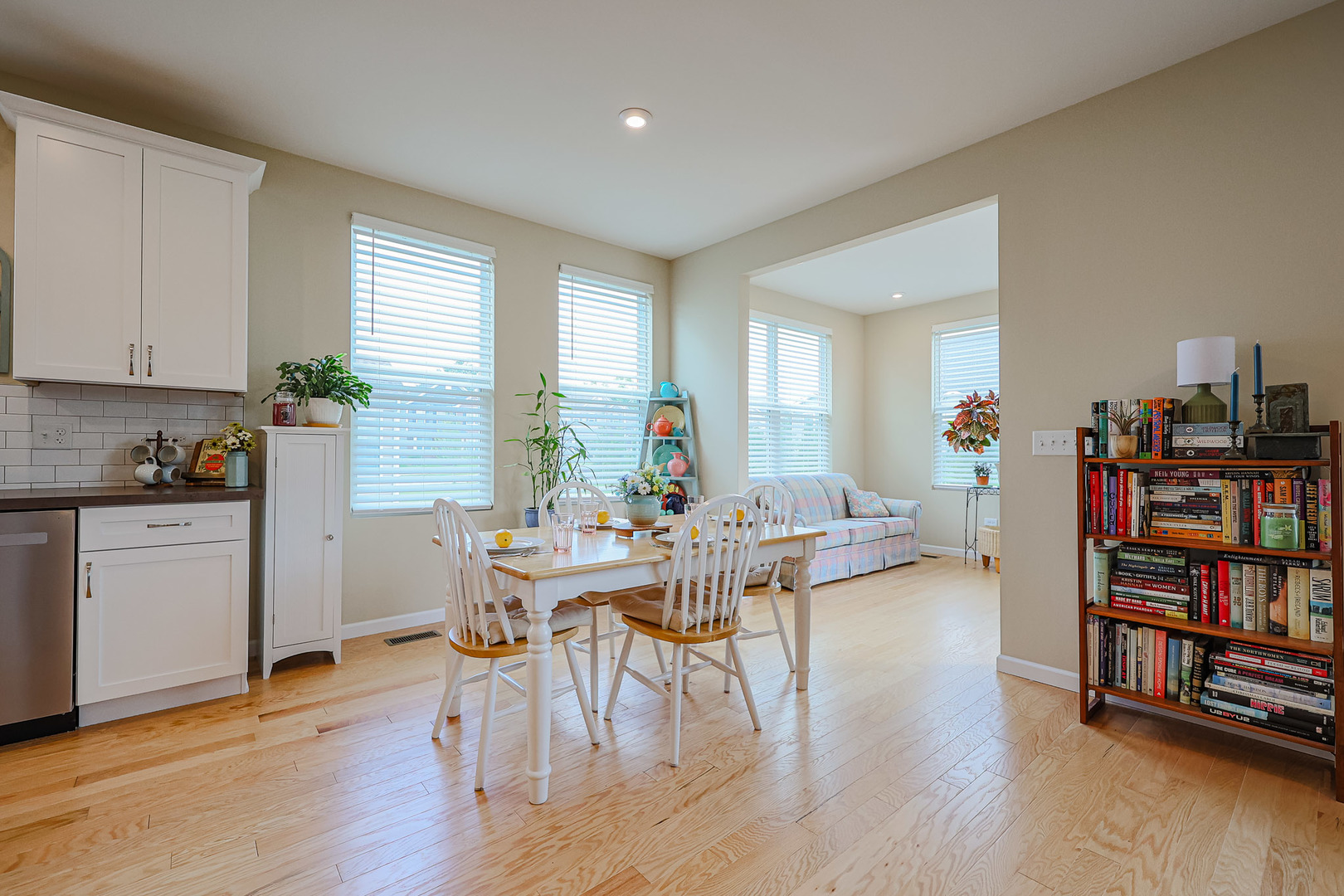 580 North Highlander Way Addison, IL 60101 - Photo 20 of 63 a view of a dining room with furniture and a book shelf