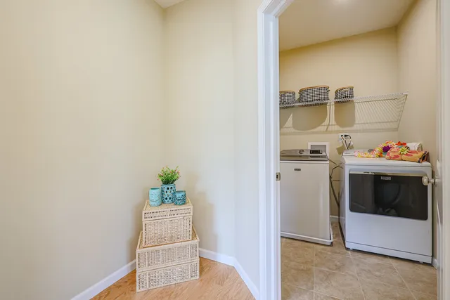 a bedroom with furniture and a flat screen tv
