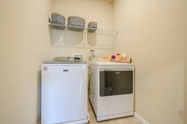 a living room with furniture and flat screen tv