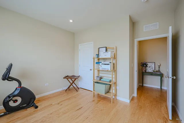 a view of hallway with wooden floor
