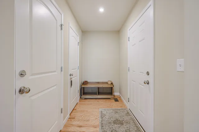 a view of empty room with wooden ceiling