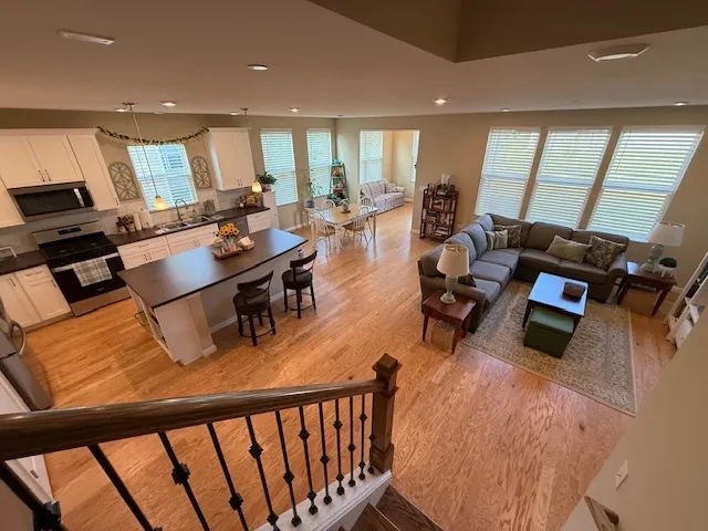 a kitchen with a sink a counter top space and stainless steel appliances