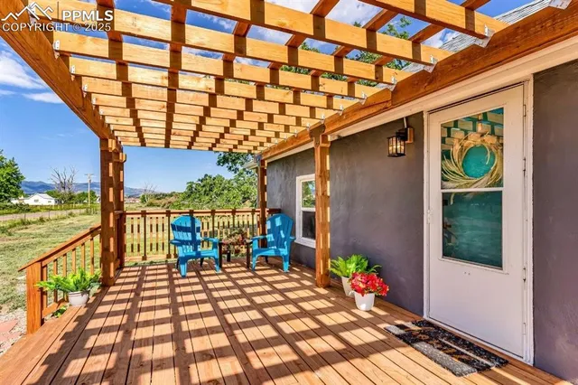 a outdoor view of a house with a potted plant