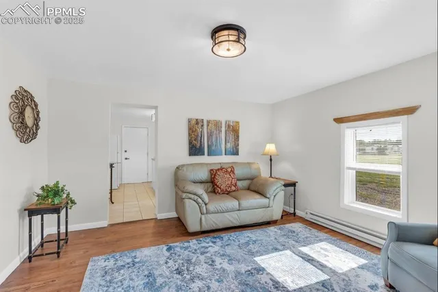 a living room with furniture and a window