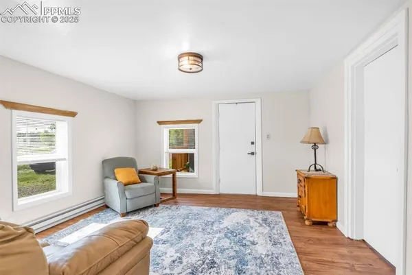 a bedroom with furniture and a window