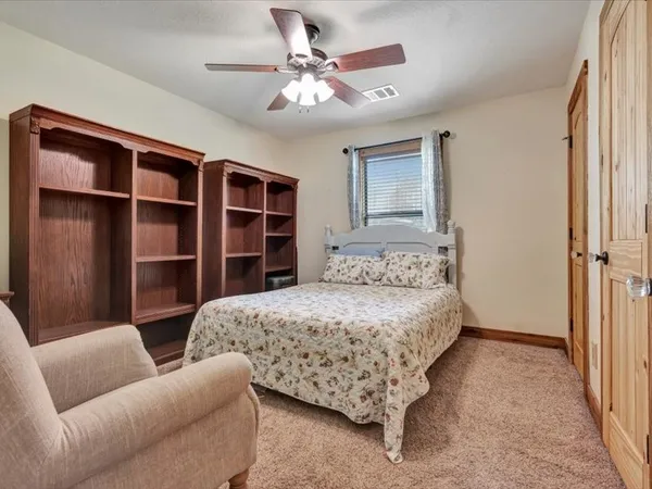 a bedroom with a bed furniture and a window