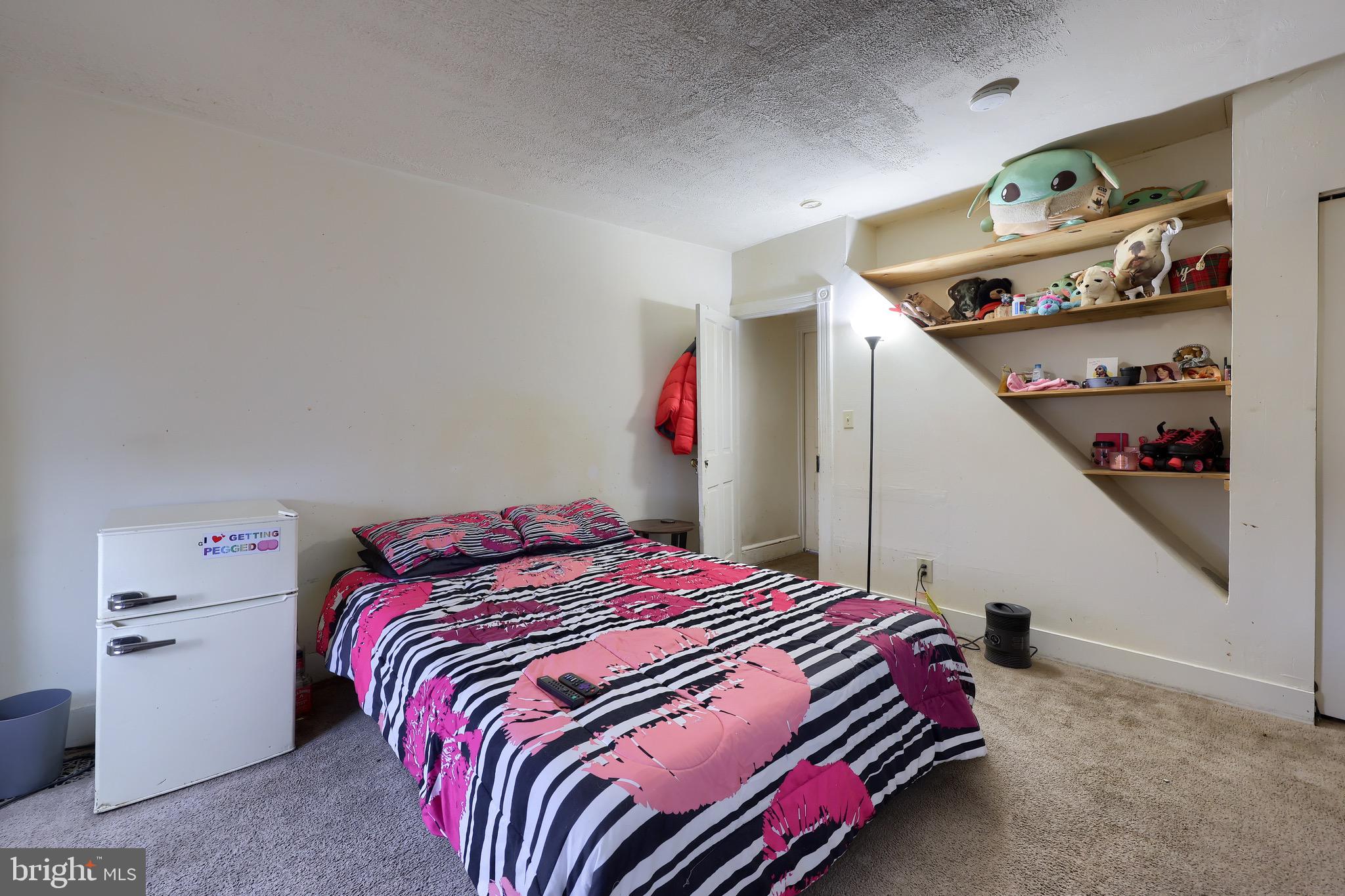 318 East Liberty Street Lancaster, PA 17602 - Photo 11 of 18 a bedroom with bed and cabinets