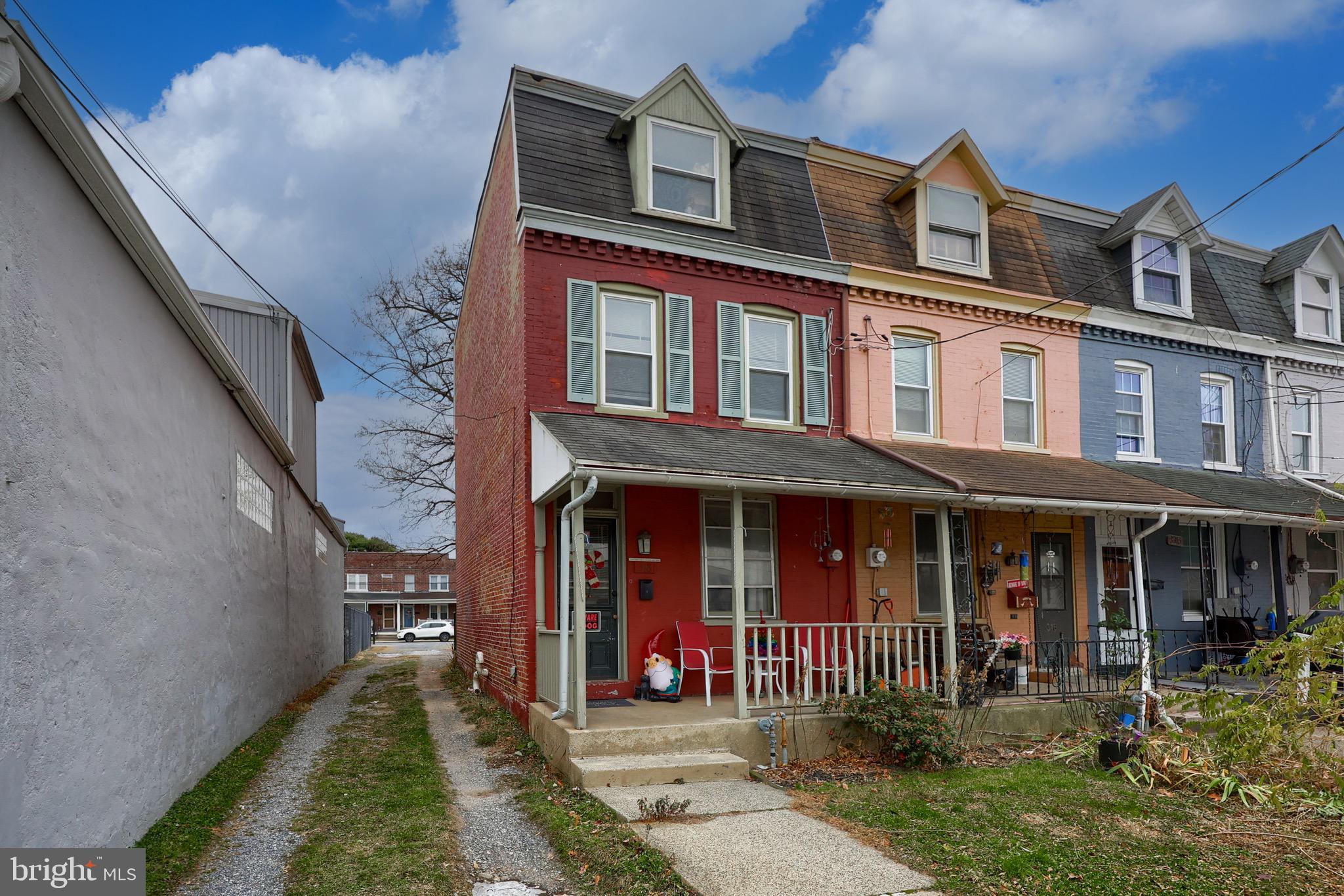 318 East Liberty Street Lancaster, PA 17602 - Photo 2 of 18 front view of a brick house with a yard