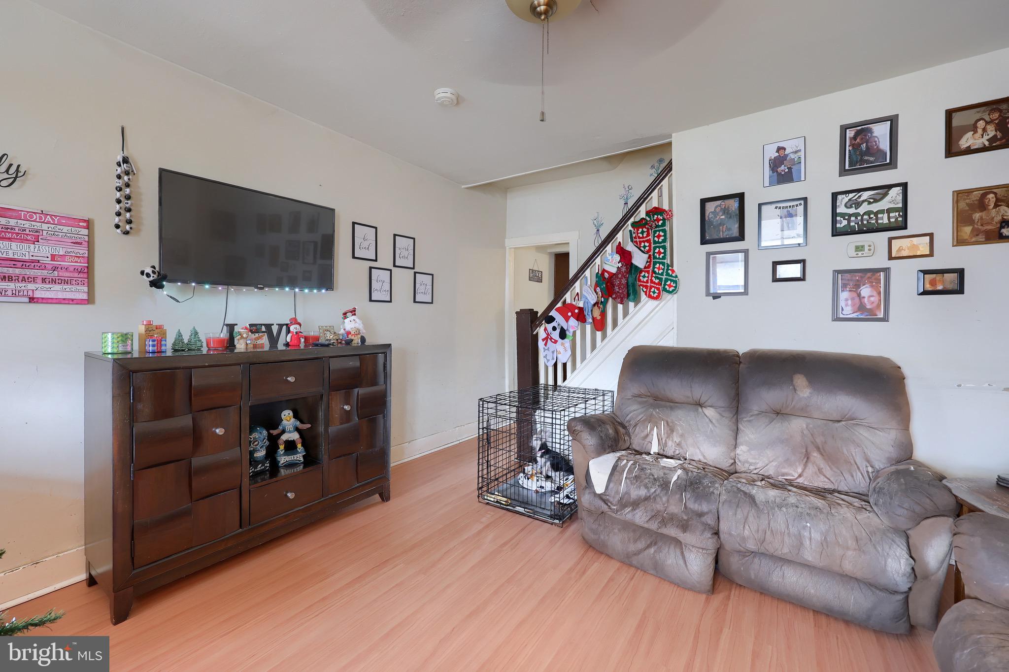 318 East Liberty Street Lancaster, PA 17602 - Photo 4 of 18 a living room with furniture and a flat screen tv