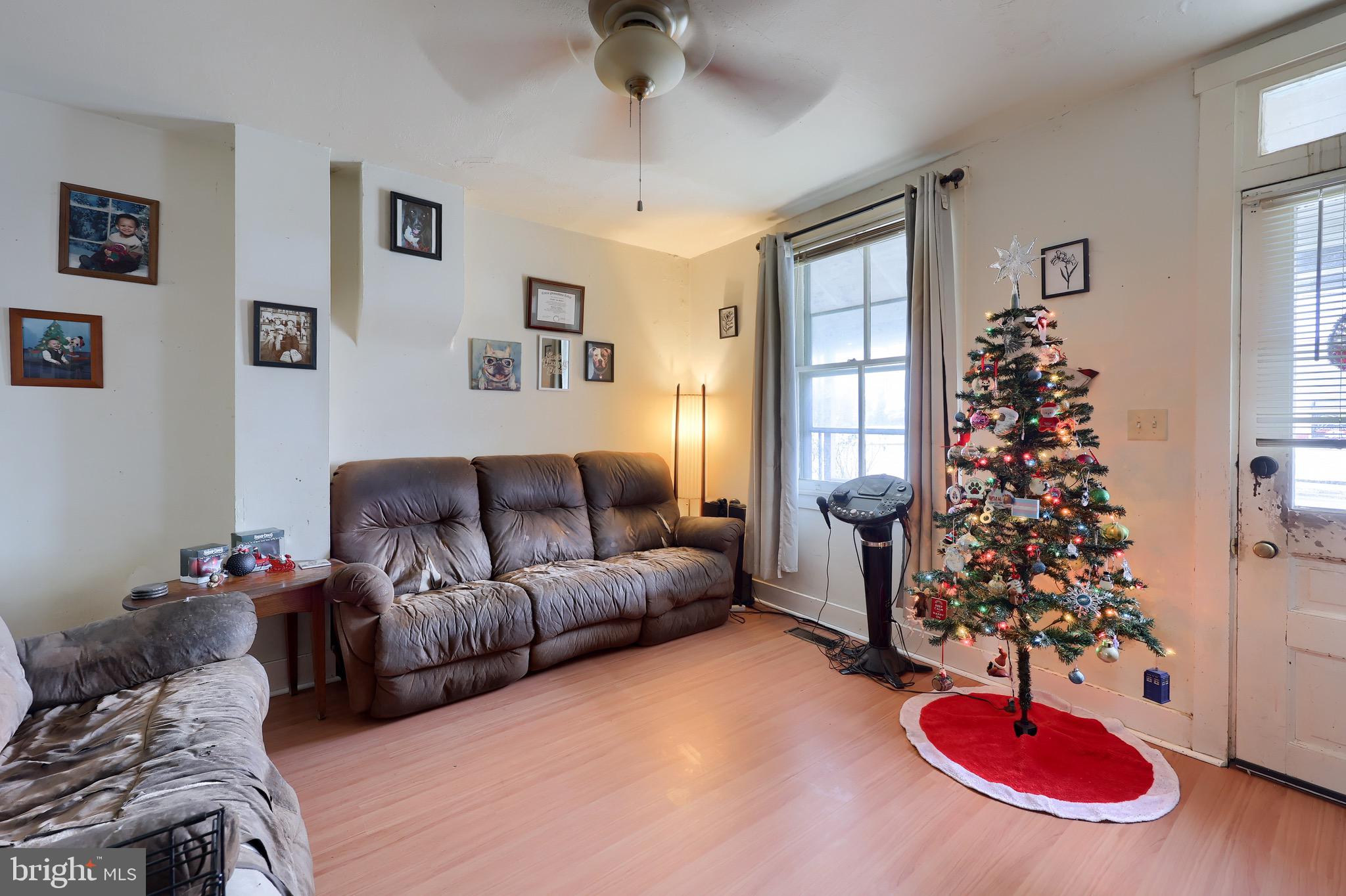 318 East Liberty Street Lancaster, PA 17602 - Photo 5 of 18 a living room with furniture and a christmas tree