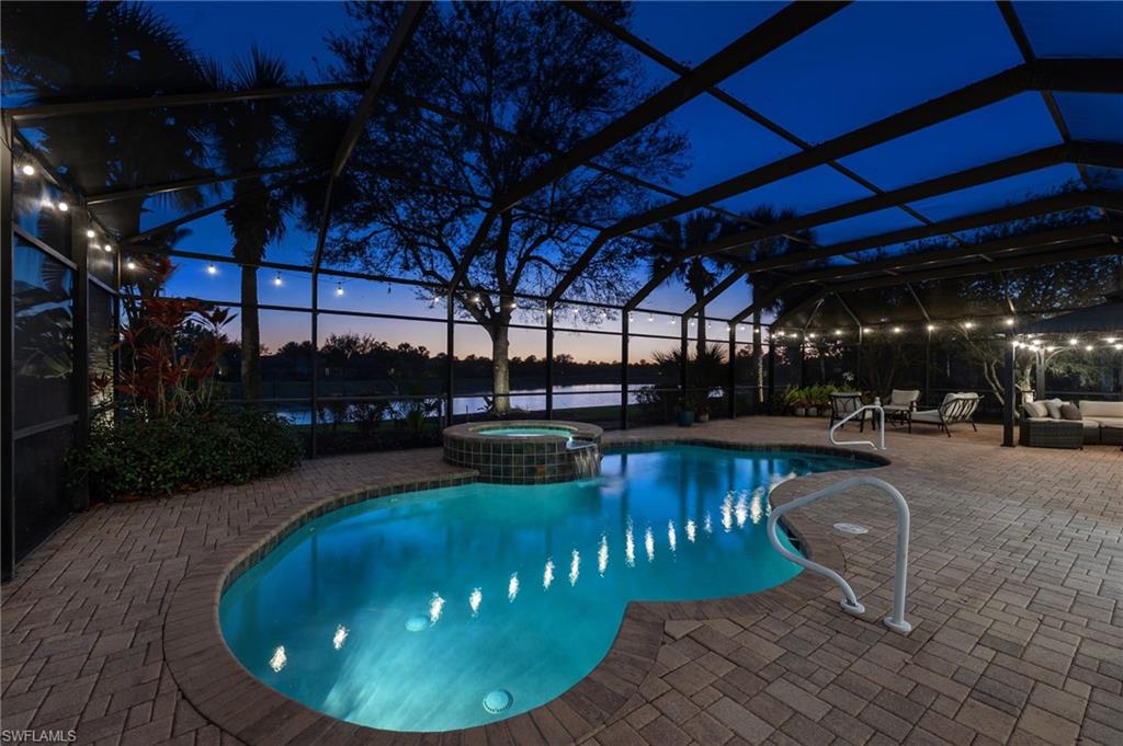 12080 Wicklow Lane Naples, FL 34120 - Photo 24 of 36 Night shot of lighted pool and lanai