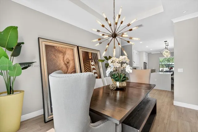 a view of dining table chairs and entryway