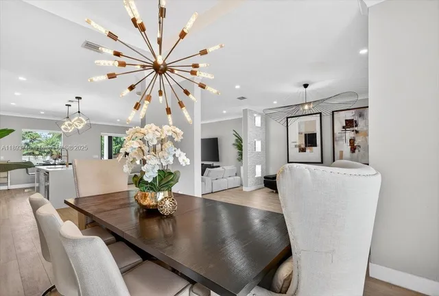 a kitchen with cabinets and wooden floor