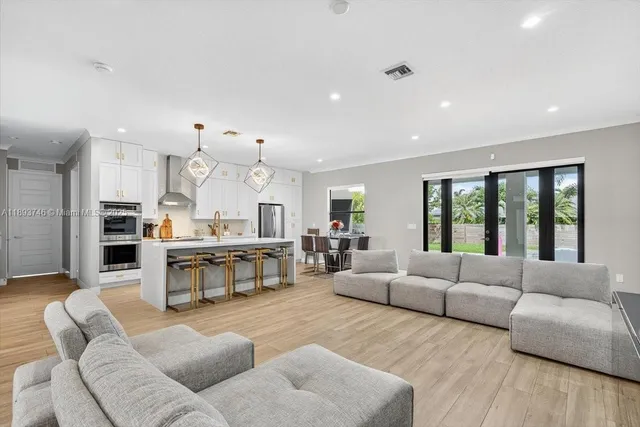 a white bath tub sitting next to a shower