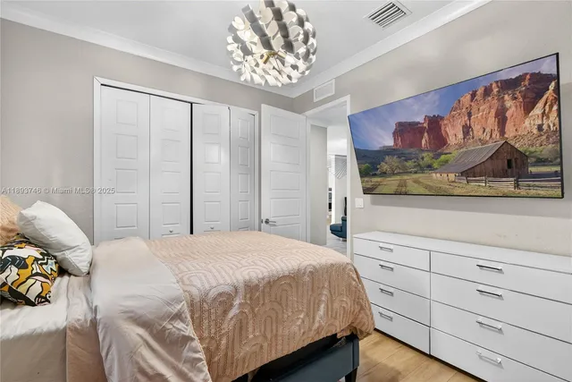 a bedroom with two beds and a window