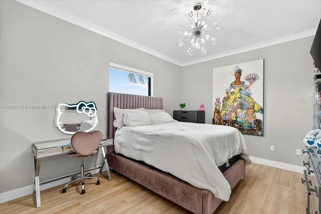 a bathroom with a light fixture a sink and a mirror