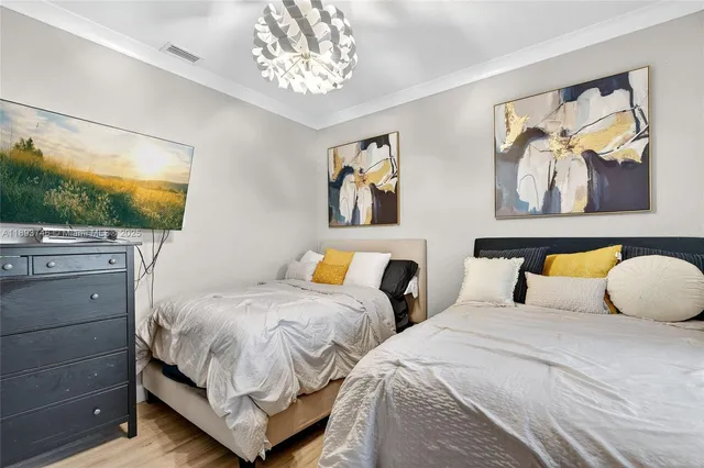 a bedroom with furniture and a window