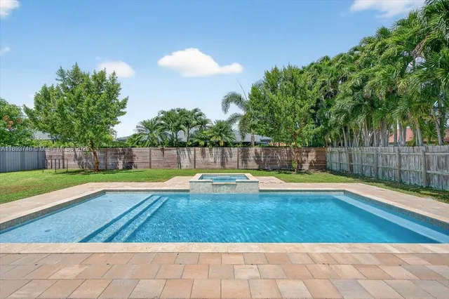 an aerial view of a house with big yard