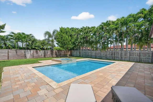 an aerial view of residential houses with outdoor space and river