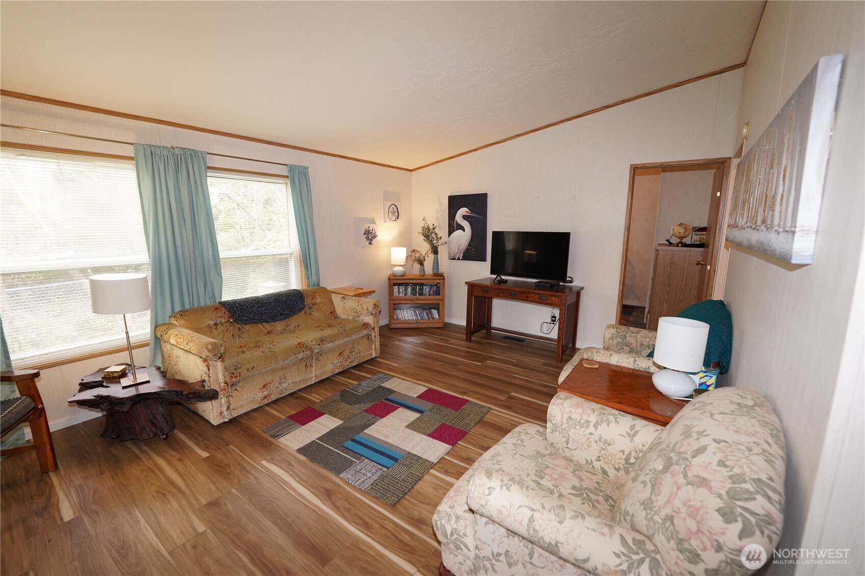 27509 Q Lane Ocean Park, WA 98640 - Photo 5 of 20 a living room with furniture and a flat screen tv