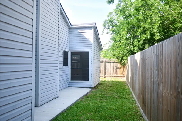 a view of a back yard of the house
