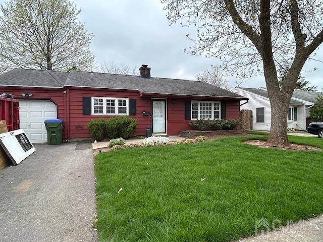 35 Weldon Road Edison, NJ 08817 - Photo 1 of 2 a front view of a house with a yard and garage
