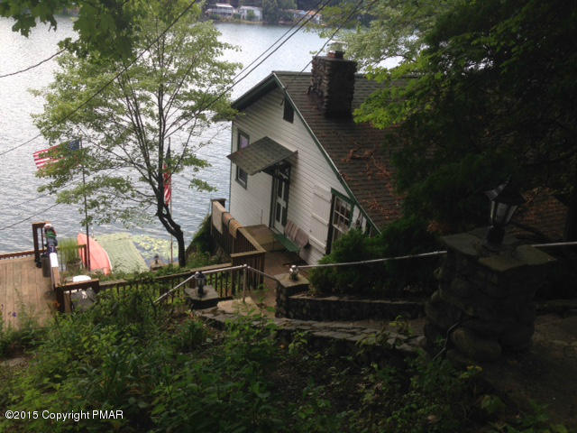 an aerial view of house with yard