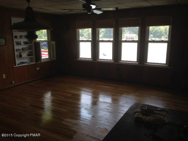 258 Echo Road Saylorsburg, PA 18353 - Photo 4 of 11 a view of empty room with wooden floor and fan