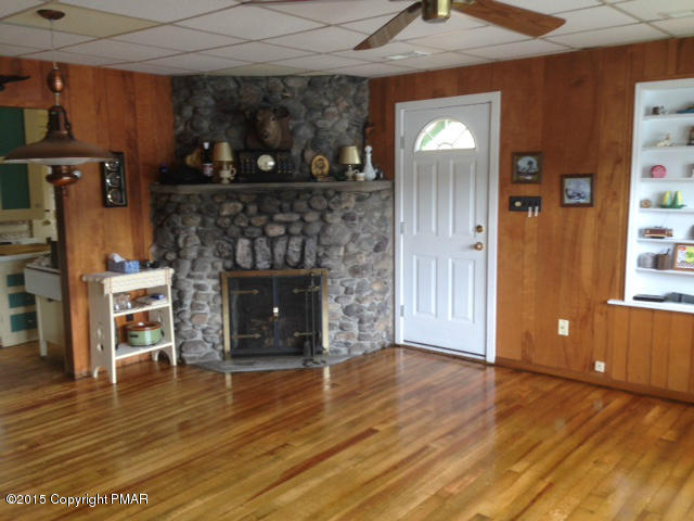 258 Echo Road Saylorsburg, PA 18353 - Photo 6 of 11 a living room with furniture and a fireplace