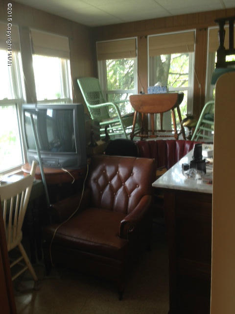 258 Echo Road Saylorsburg, PA 18353 - Photo 7 of 11 a living room with furniture and a floor to ceiling window