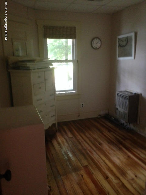 258 Echo Road Saylorsburg, PA 18353 - Photo 8 of 11 a view of an empty room with wooden floor and a window