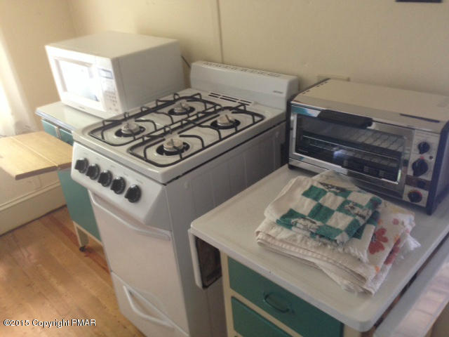 258 Echo Road Saylorsburg, PA 18353 - Photo 10 of 11 a white stove top oven sitting inside of a kitchen