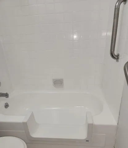 a view of an empty room and a window