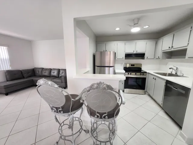 a room with a bed and a sink