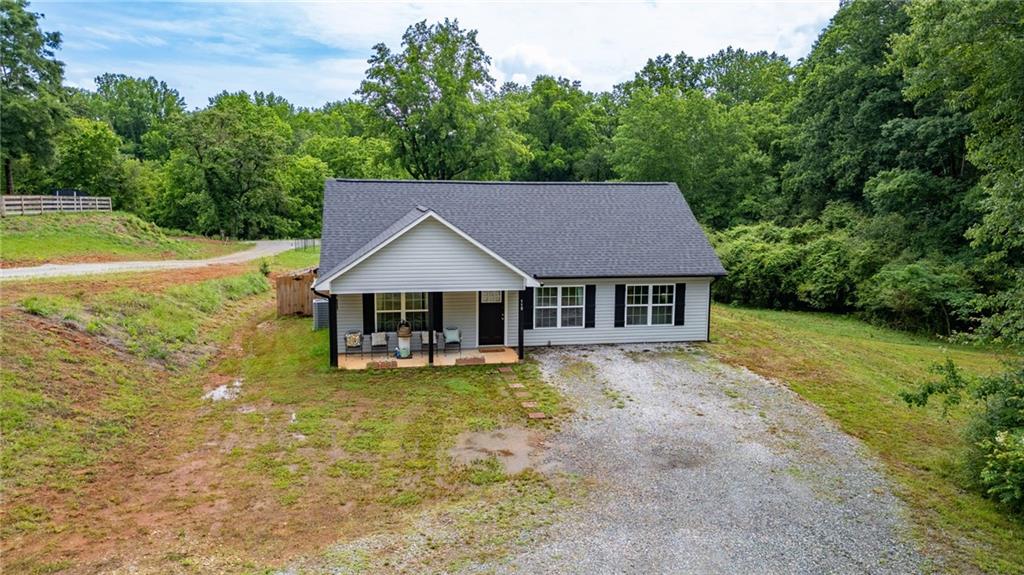 118 Wash Rider Road Dahlonega, GA 30533 - Photo 28 of 37 a view of a house with pool and a yard
